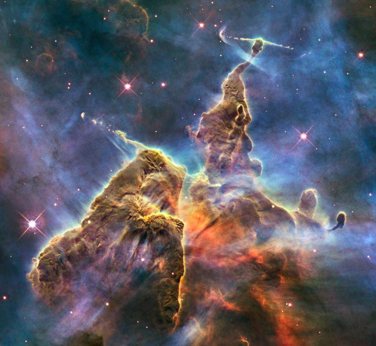 A three-light-year-tall pillar of gas and dust in the Carina Nebula, photographed by the Hubble Space Telescope for its 20th anniversary